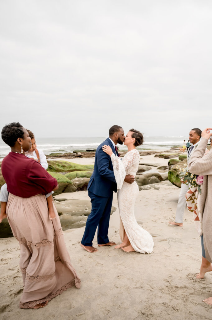 first kiss during ceremony on the beach